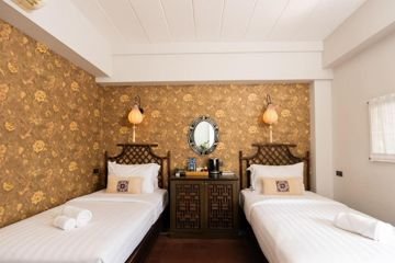 Twin guest bedroom at Baan Chart Hotel