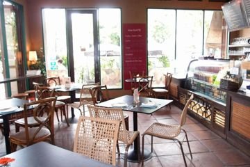 Restaurant tables beside windows at Chetuphon Gate