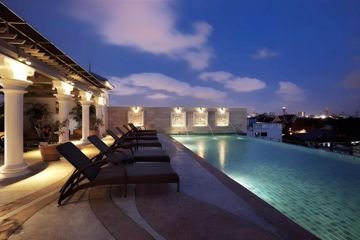 Rooftop swimming pool at dusk at Chillax Resort Khaosan
