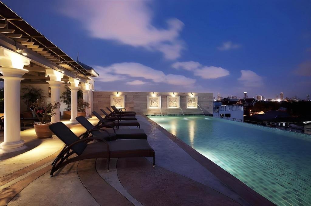 Rooftop swimming pool at dusk at Chillax Resort Khaosan