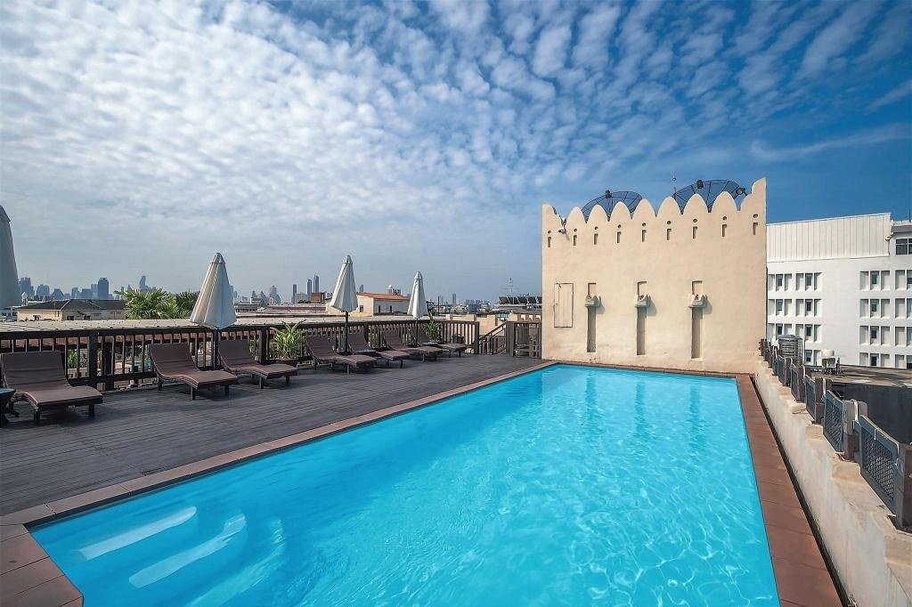 Rooftop swimming pool at Dewan Bangkok Hotel