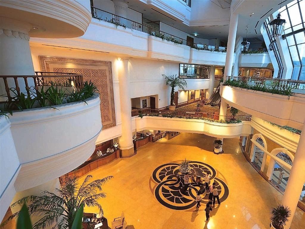 Atrium lobby and reception at Montien Riverside Hotel Bangkok