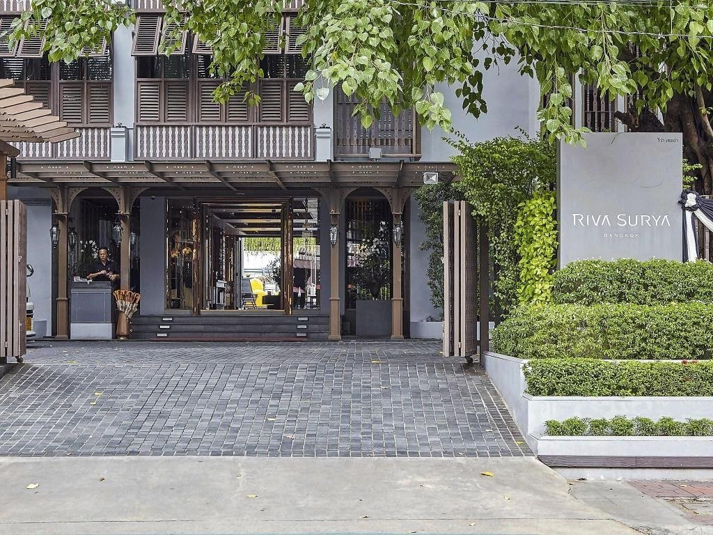 Hotel entrance and trees at Riva Surya Bangkok Hotel