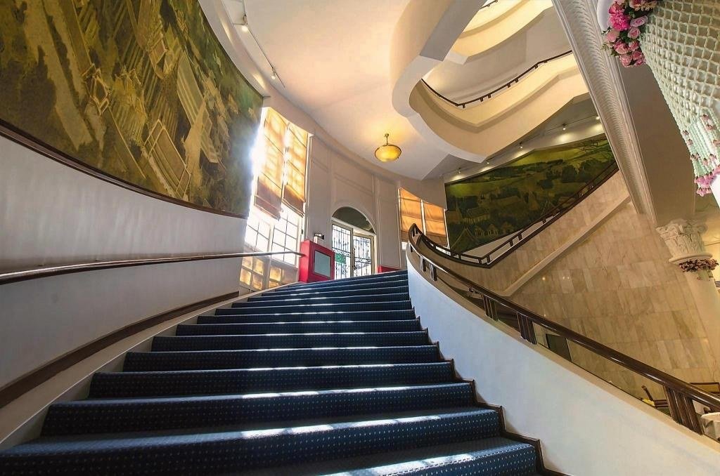 Curving interior staircase at Royal Rattanakosin Hotel