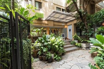 Plant-lined entrance courtyard at Sourire at Rattanakosin Island Hotel