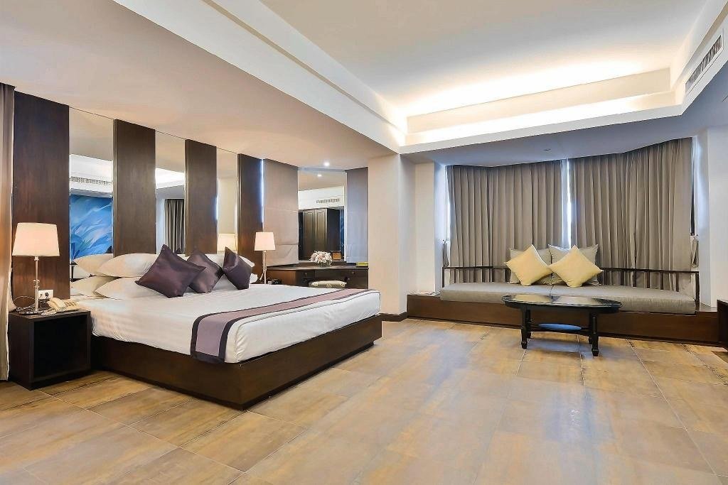 Guest room with wooden floor at The Grand Sathorn Hotel